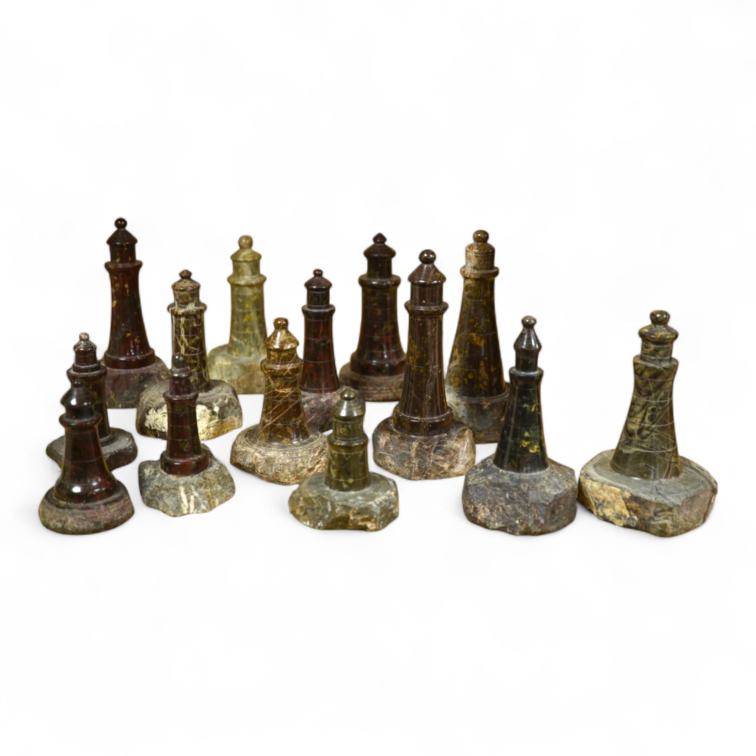 A collection of Cornish serpentine stone carved lighthouses, tallest 13cm high
